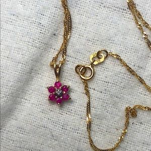 Ruby diamond flower necklace in 10k yellow gold